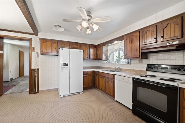 kitchen featuring light carpet, ceiling fan, sink, and white appliances