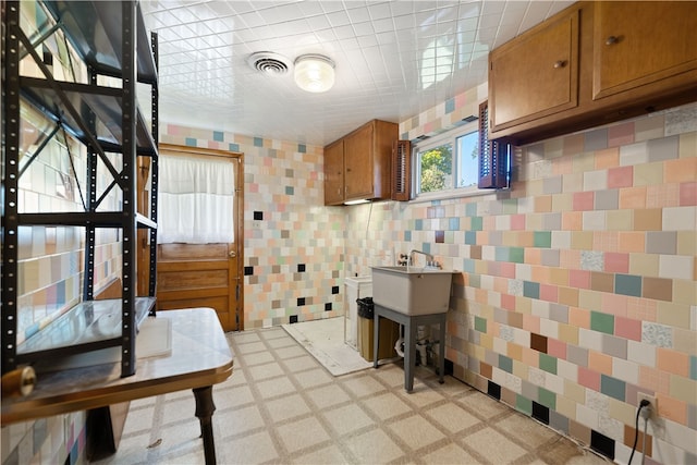 kitchen with tile walls