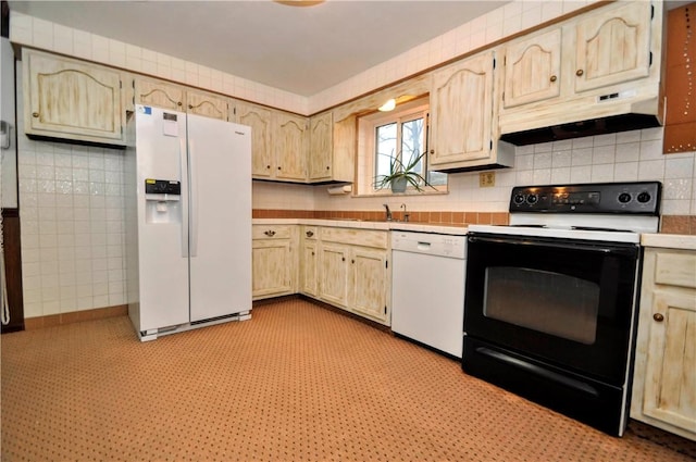 kitchen with light brown cabinets, under cabinet range hood, white appliances, light countertops, and light floors