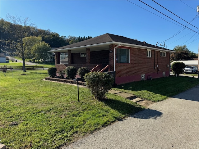 view of property exterior with a yard