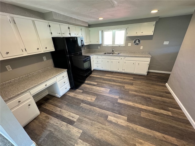 kitchen featuring dark hardwood / wood-style flooring, sink, and white cabinets