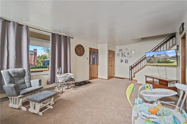 sitting room featuring carpet flooring