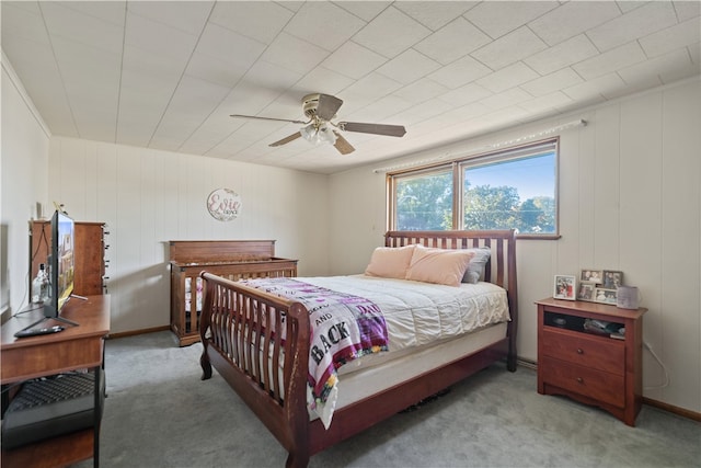 bedroom featuring ceiling fan and light carpet