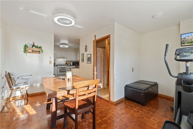 dining area with parquet flooring