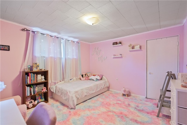 carpeted bedroom featuring crown molding