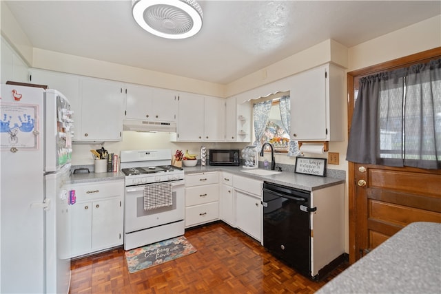 kitchen featuring sink, black appliances, white cabinets, and dark parquet floors