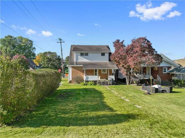 rear view of house with a yard