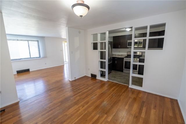 empty room with dark hardwood / wood-style flooring