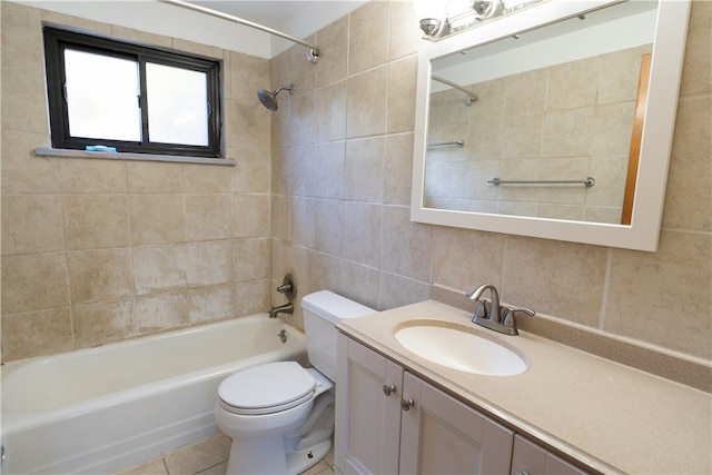 full bathroom with vanity, tiled shower / bath, toilet, and tile walls