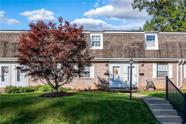 view of front of home with a front lawn