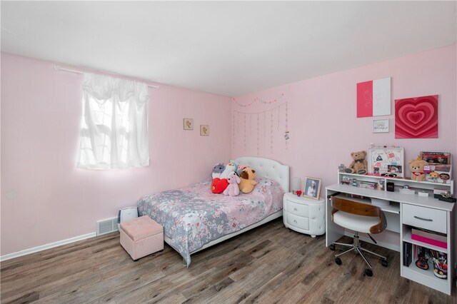 bedroom featuring wood-type flooring