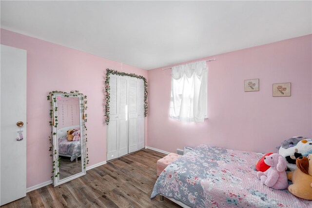 bedroom featuring a closet and hardwood / wood-style flooring