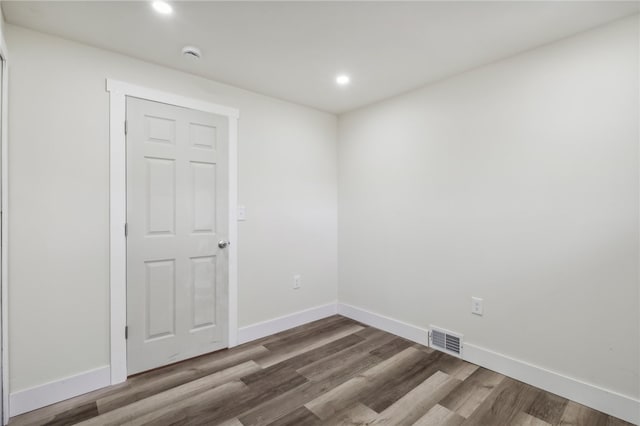 empty room featuring wood-type flooring