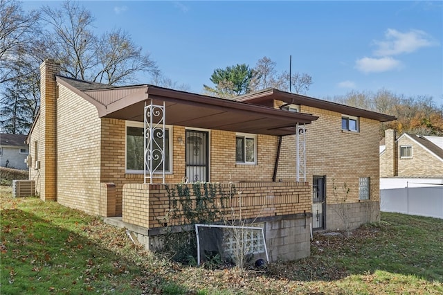 exterior space with a lawn and covered porch