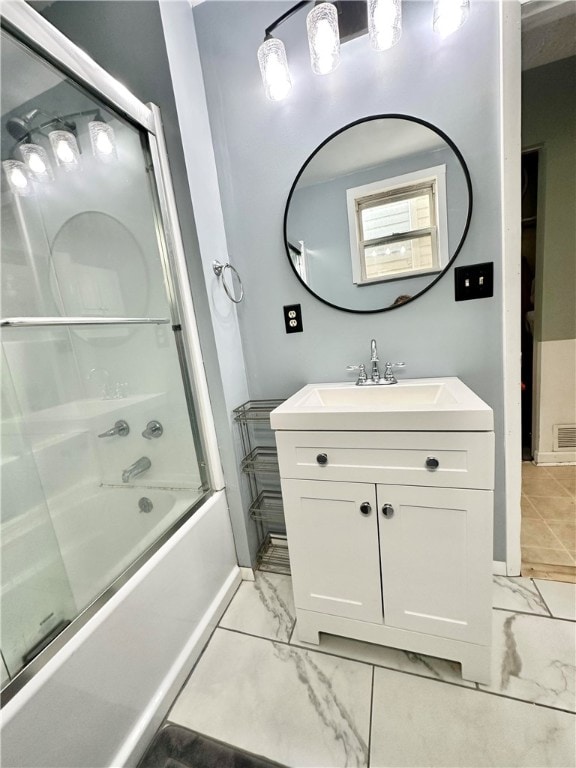 bathroom featuring vanity and enclosed tub / shower combo