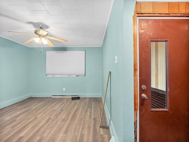 unfurnished room featuring hardwood / wood-style floors and ceiling fan