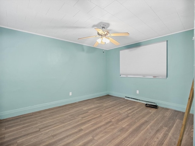 empty room with crown molding, hardwood / wood-style floors, and ceiling fan