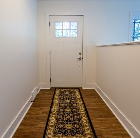 doorway to outside featuring dark hardwood / wood-style flooring