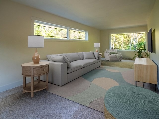 living room with light carpet and plenty of natural light