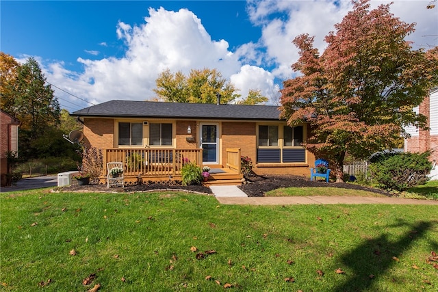 single story home with a front lawn