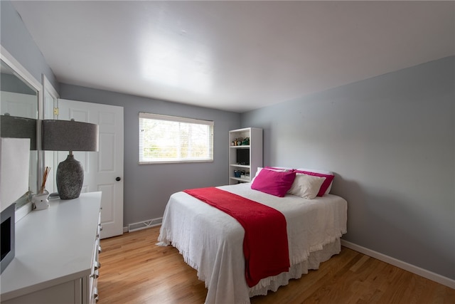 bedroom with light hardwood / wood-style floors