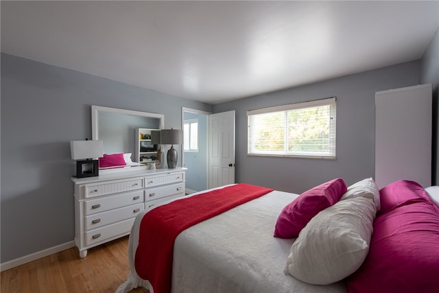 bedroom featuring light hardwood / wood-style flooring