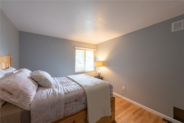 bedroom with light wood-type flooring