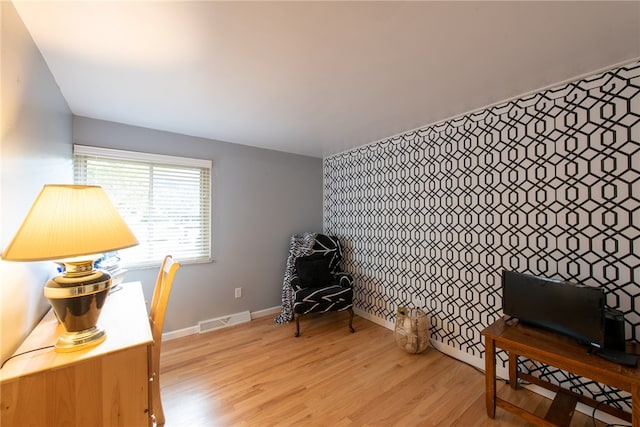 sitting room with light wood-type flooring