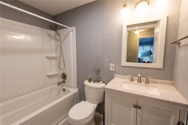 full bathroom featuring vanity, washtub / shower combination, and toilet