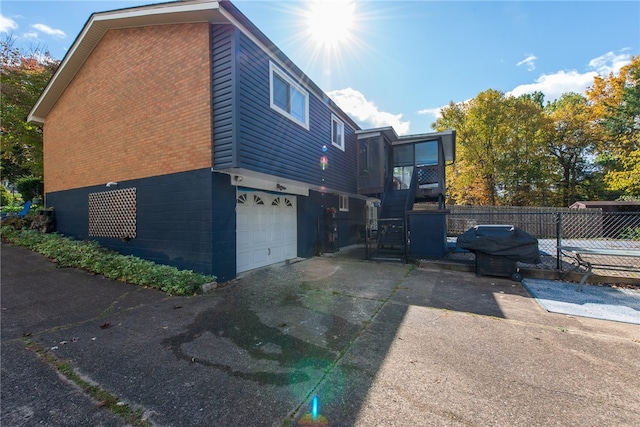 view of property exterior featuring a garage