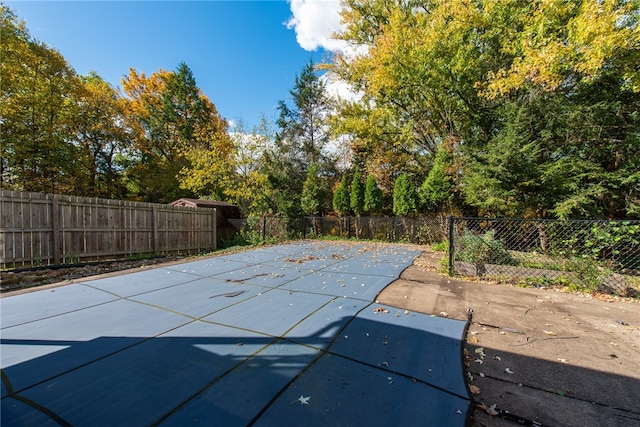 view of pool featuring a patio