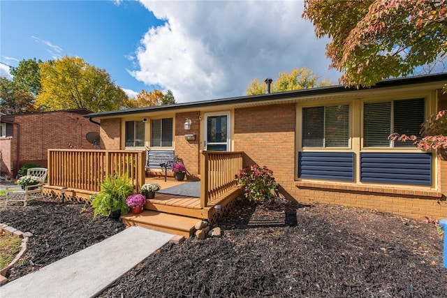 ranch-style home featuring a deck