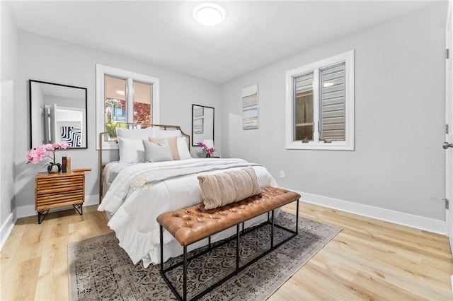 bedroom with light wood-type flooring