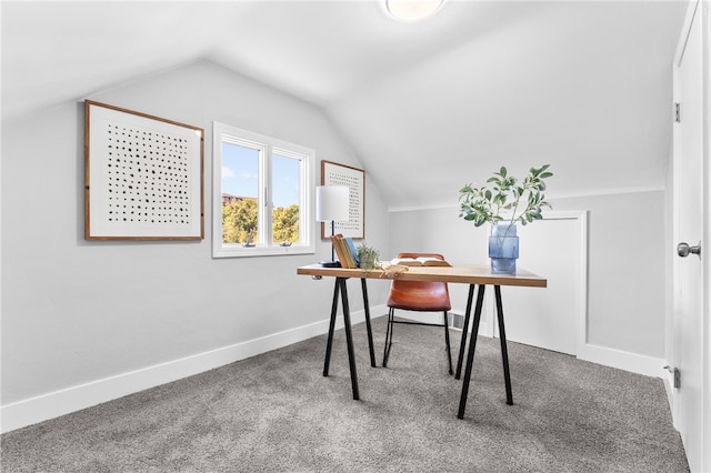 carpeted office featuring vaulted ceiling