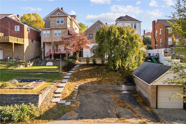 exterior space featuring a front lawn and a garage