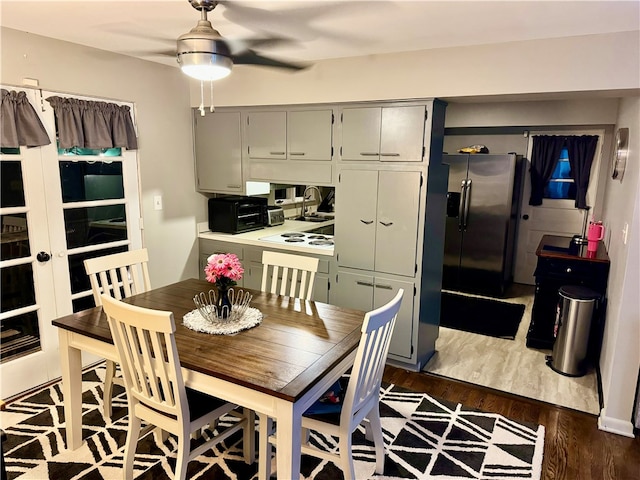 dining area with dark hardwood / wood-style flooring