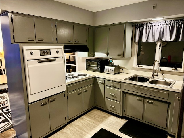 kitchen with white appliances and sink