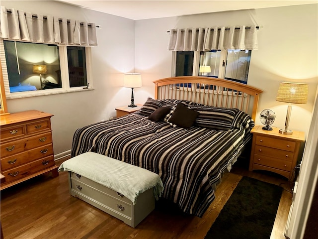 bedroom featuring dark wood-type flooring