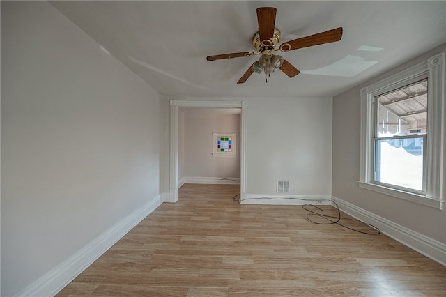 unfurnished room with light wood-type flooring and ceiling fan