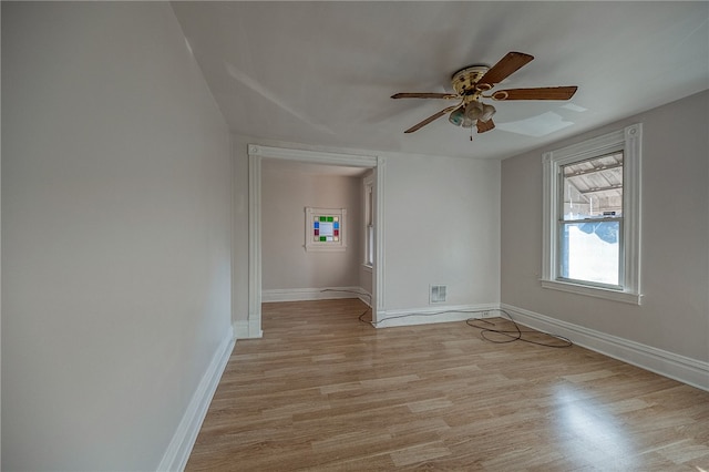 unfurnished room featuring ceiling fan and light hardwood / wood-style flooring