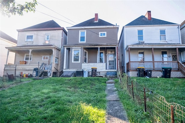 view of front of house featuring a front yard and a porch