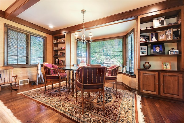 dining room featuring beamed ceiling, a notable chandelier, and dark hardwood / wood-style flooring