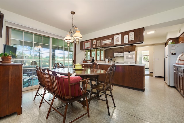 dining area featuring a chandelier