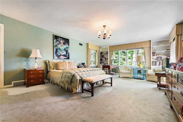 bedroom featuring a notable chandelier and light colored carpet