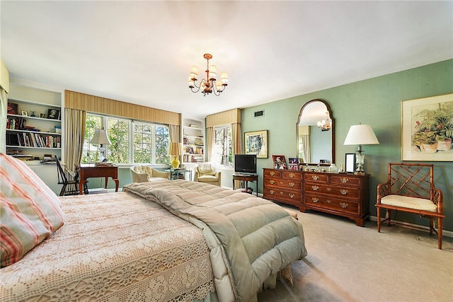 bedroom featuring carpet floors and a chandelier