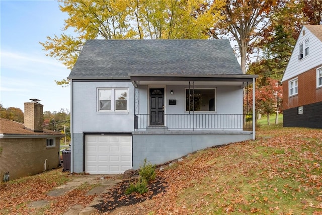 view of front of home featuring a porch and a garage