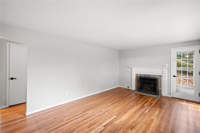 unfurnished living room with light hardwood / wood-style floors