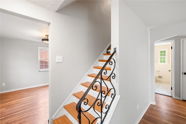 staircase featuring hardwood / wood-style flooring