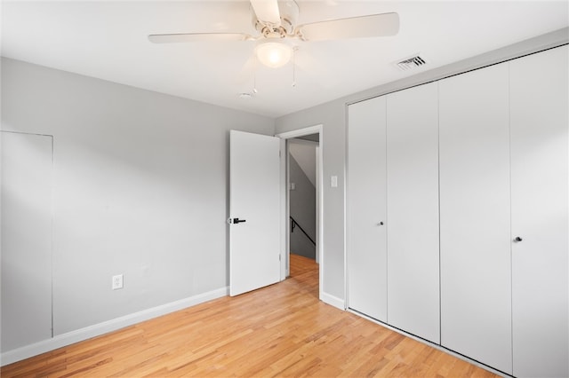 unfurnished bedroom with a closet, ceiling fan, and light hardwood / wood-style floors