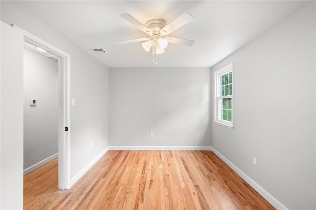 unfurnished room with ceiling fan and light hardwood / wood-style flooring